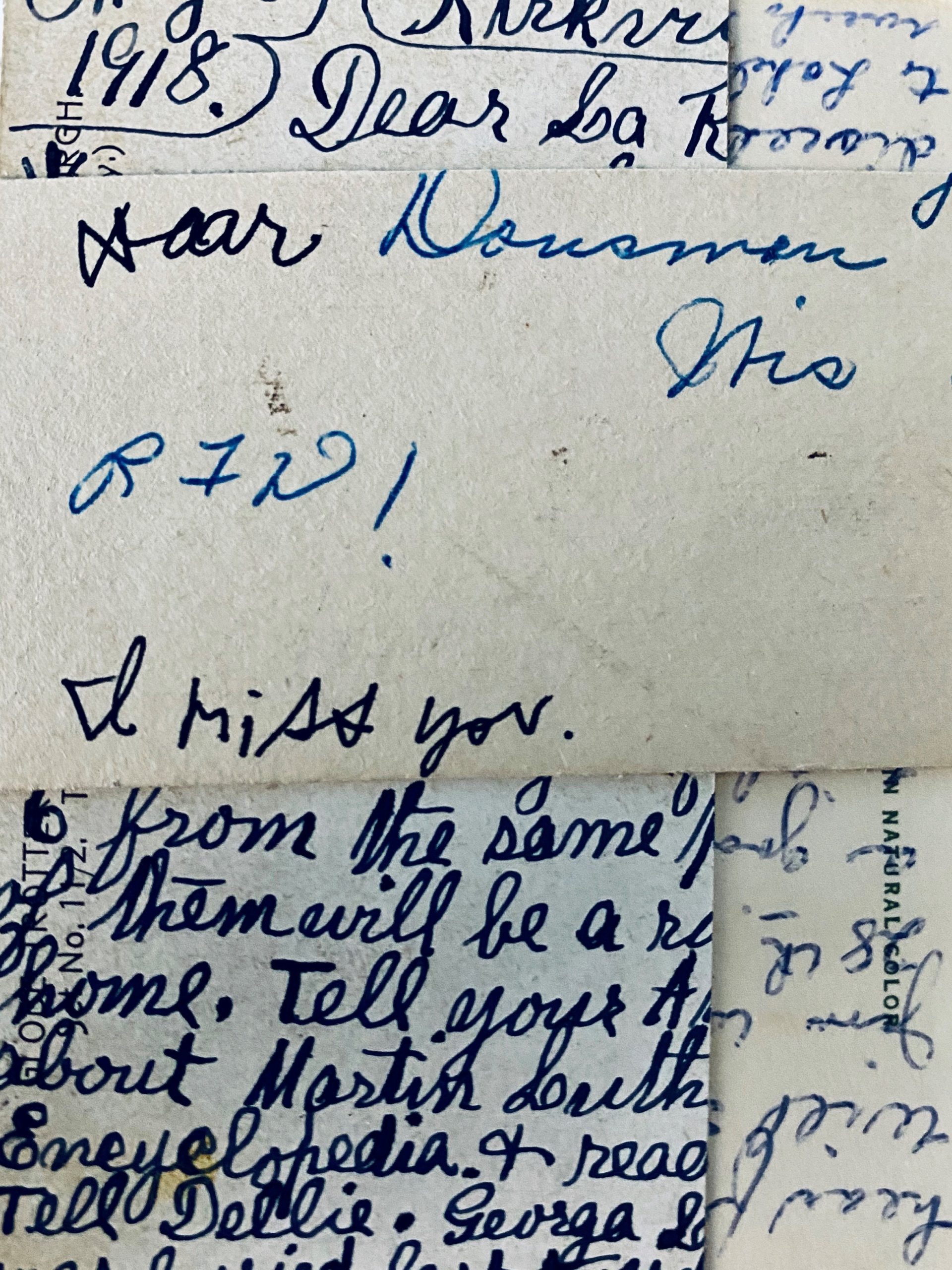 Alt Text: A collage of different cursive handwritings written in ink overlap one another. Most of the sentences are cut off, but the phrases “I miss you,” “RIP!”, and “1918” can be read.