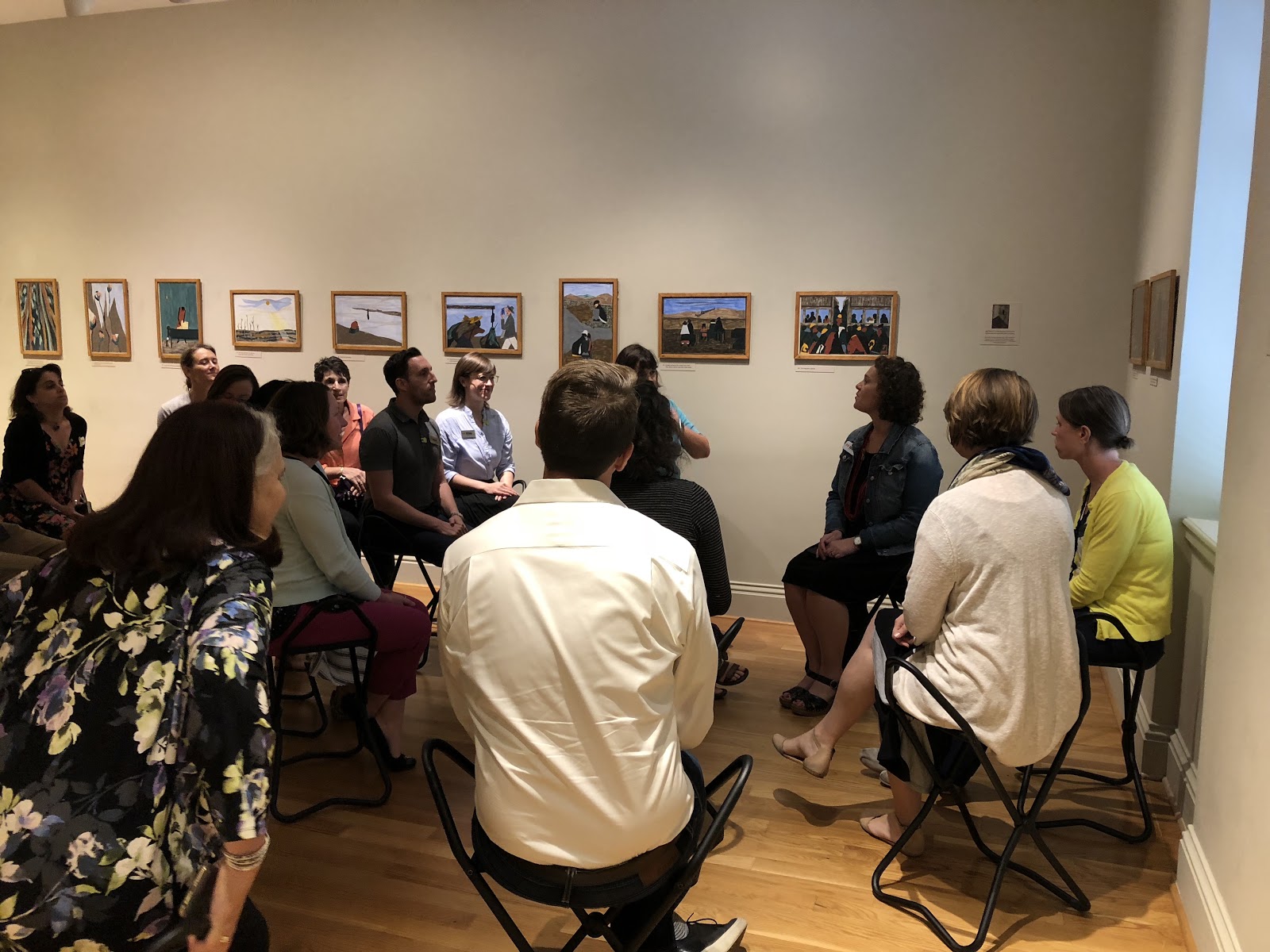 MER President Amanda Thompson Rundahl, seated third from the right, leads a reflection activity in the exhibition "Jacob Lawrence: The Migration Series" at The Phillips Collection during the 2018 MER Board Retreat. 