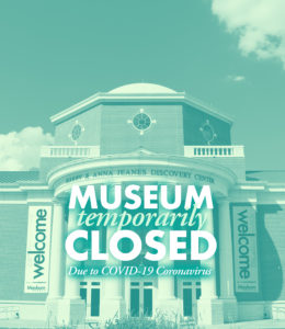 An outside view of a brick museum with many windows. Superimposed over the museum are the words, "Museum temporarily closed due to Covid-19 pandemic."